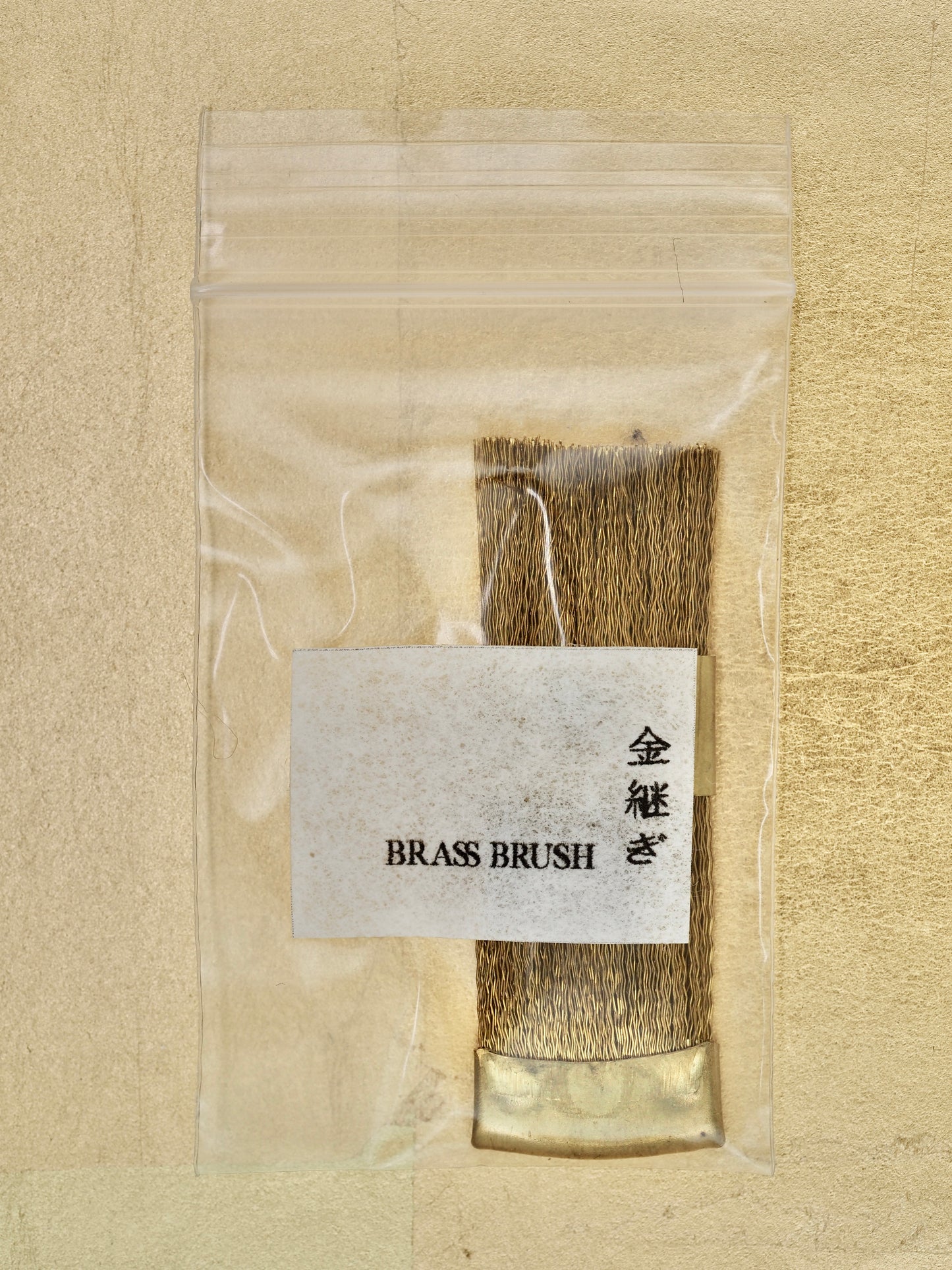 Brass wire brush for ceramic cleaning purposes
