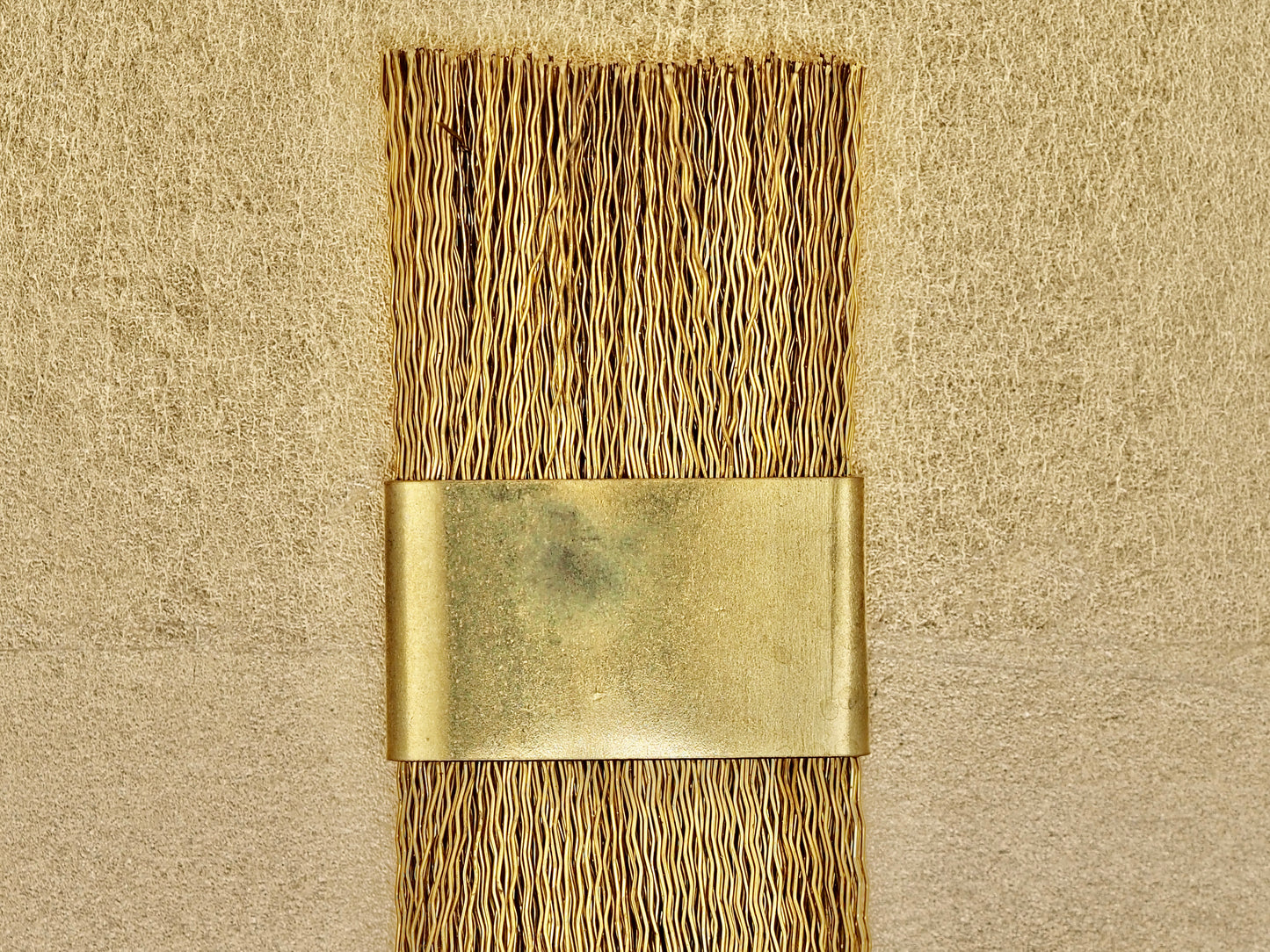 Brass wire brush for ceramic cleaning purposes